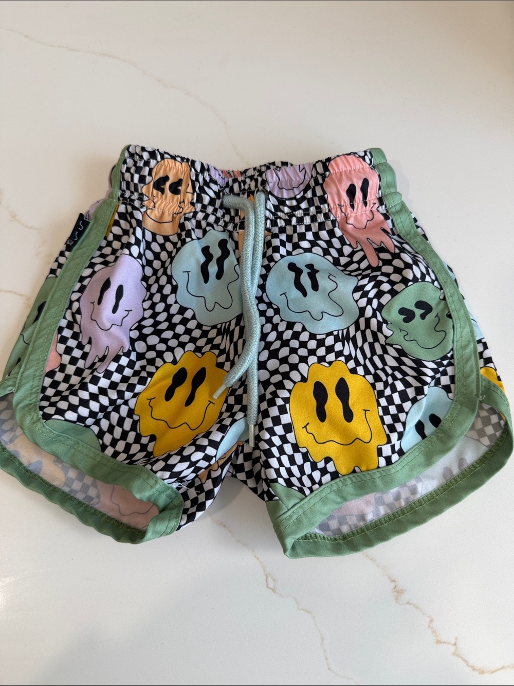 Kids Green Trim Checkerboard Swim Trunks with Colorful Smiley Prints